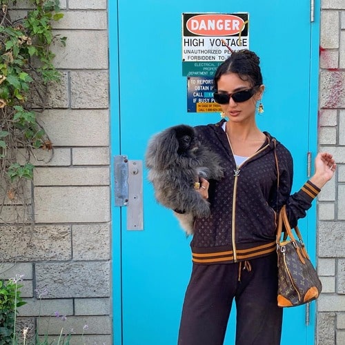 Medalion Rahimi carrying her pet 